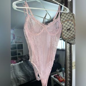 Baby pink body suit